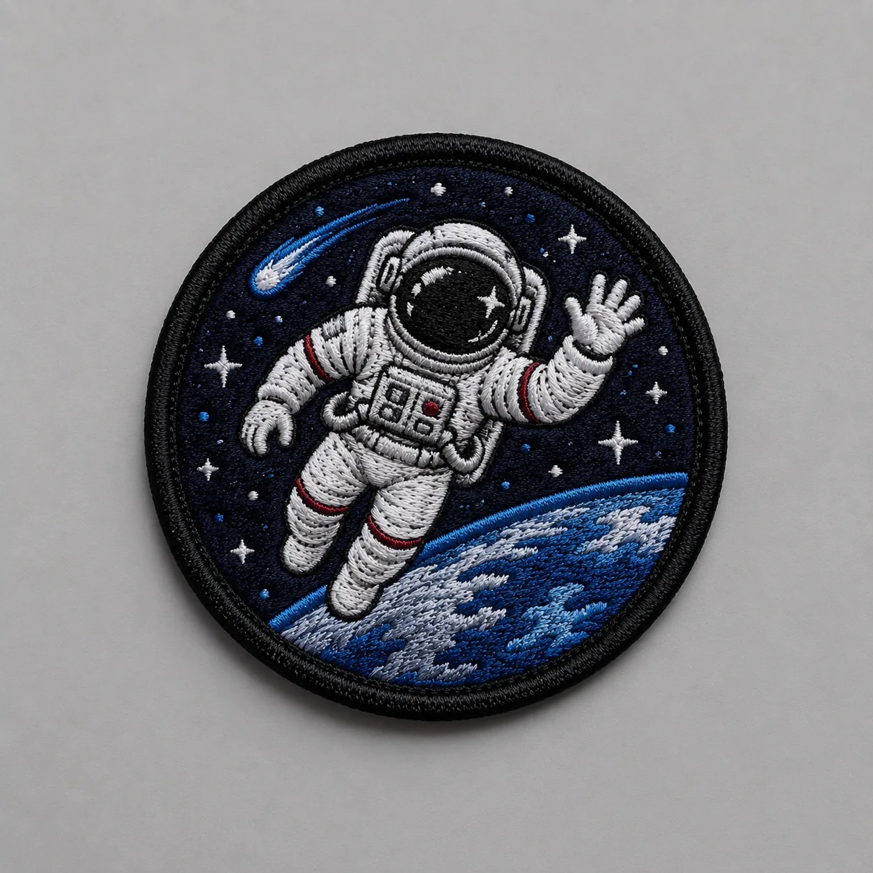 Embroidered patches showing dense satin stitching and a merrowed border